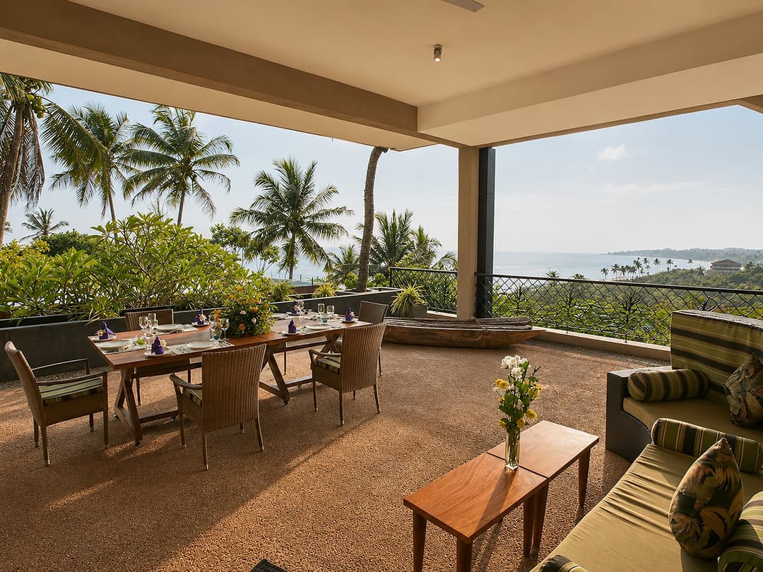 Mirissa covered dining terrace with palm view