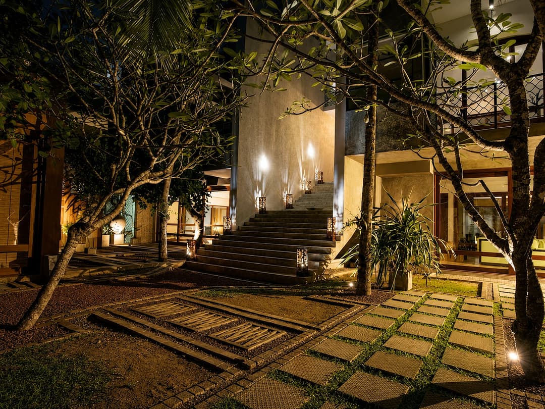 Mirissa entrance stairway lit at night