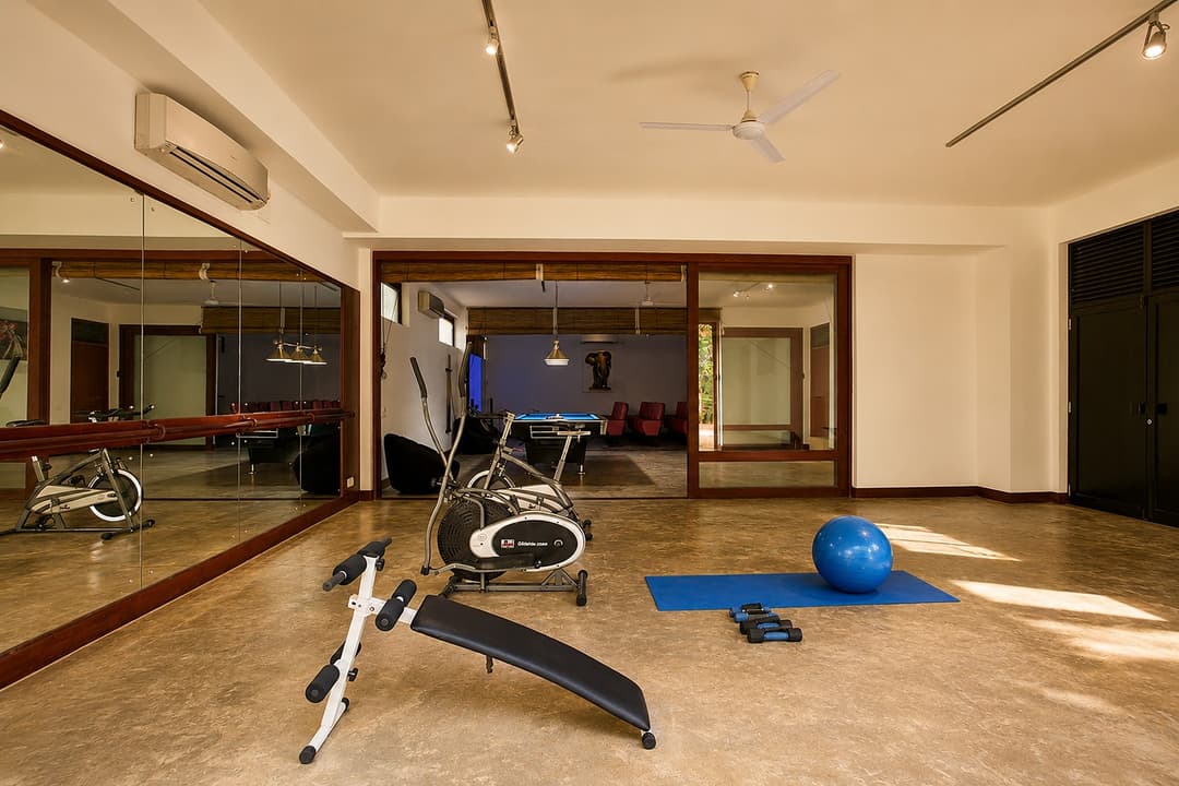 Mirissa gym with equipment and mirrors