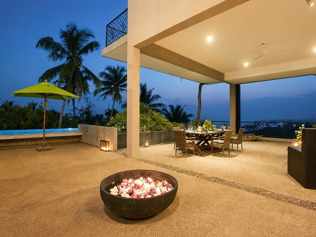 Mirissa rooftop dining at dusk with candles