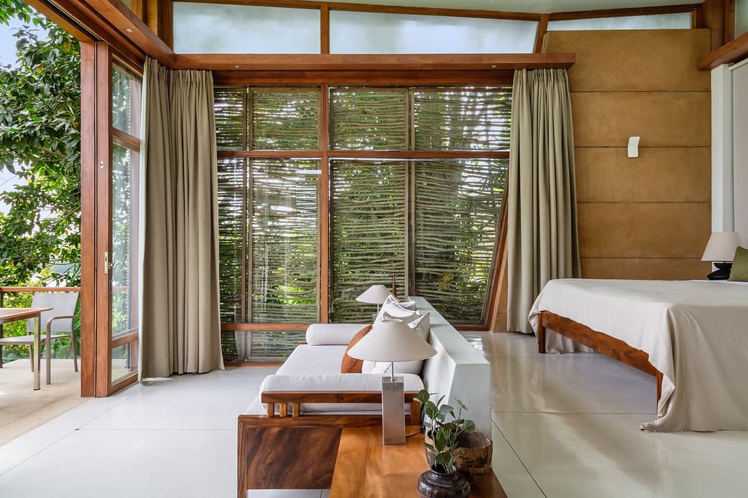 Tri Ahangama Lake Villa bedroom with windows