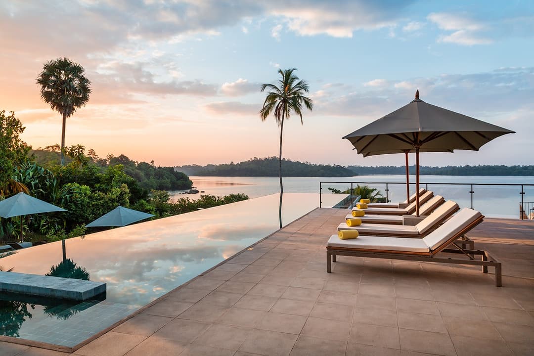 Tri Ahangama main pool with loungers at sunset