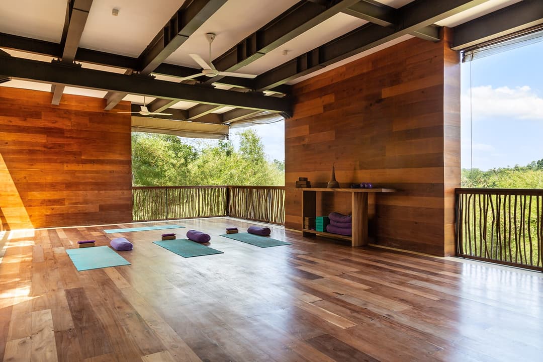 Tri Ahangama Yoga Shala interior with mats