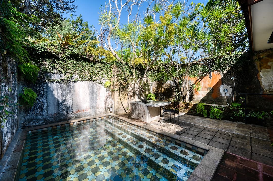 Lunuganga Bentota tiled pool with garden walls