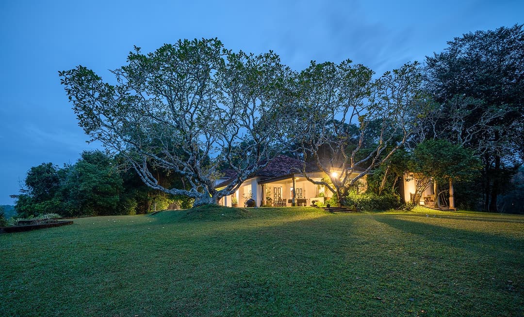 Lunuganga Bentota property exterior at dusk