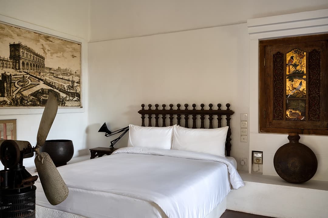 Lunuganga Bentota bedroom with white bed and art
