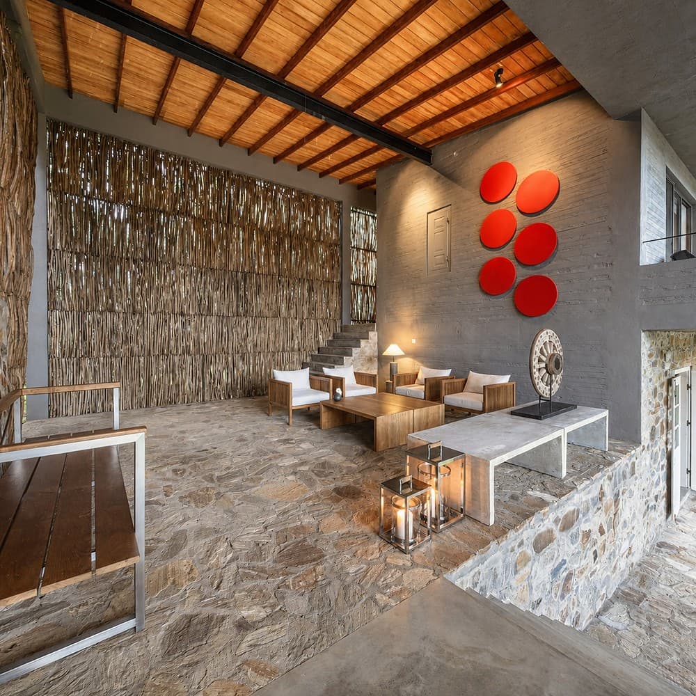 Digana lounge with stone wall and red art