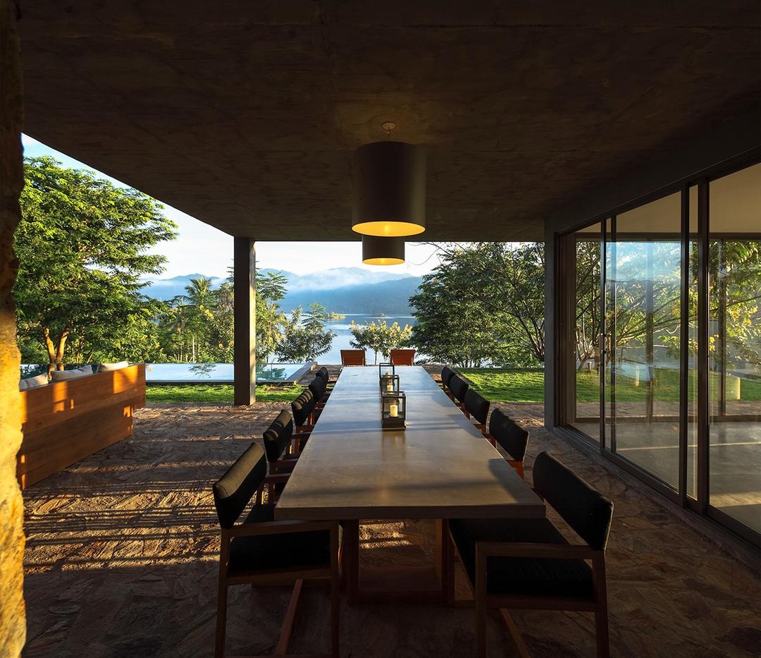 Digana dining terrace with long table and lake view