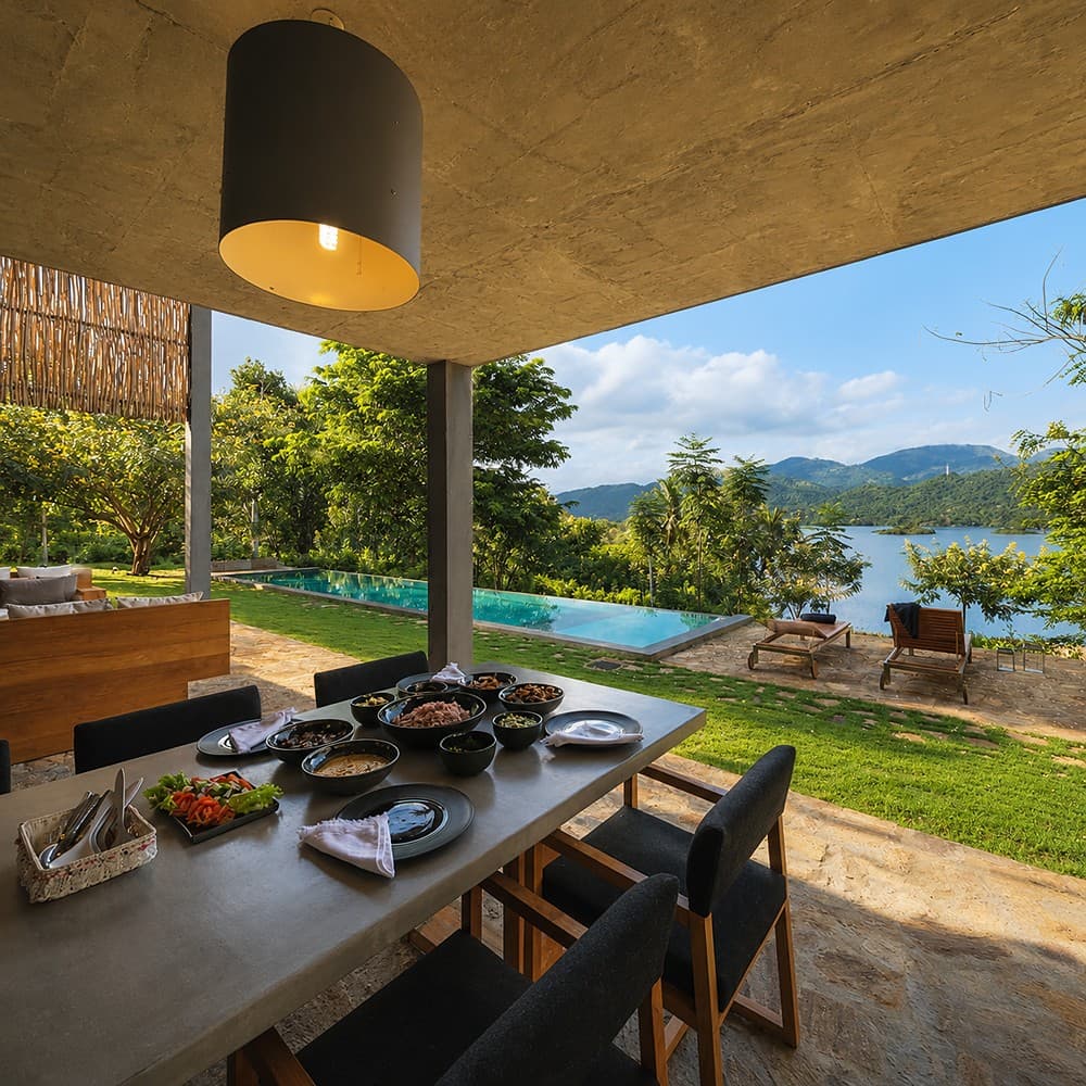 Digana dining table with exterior pool view