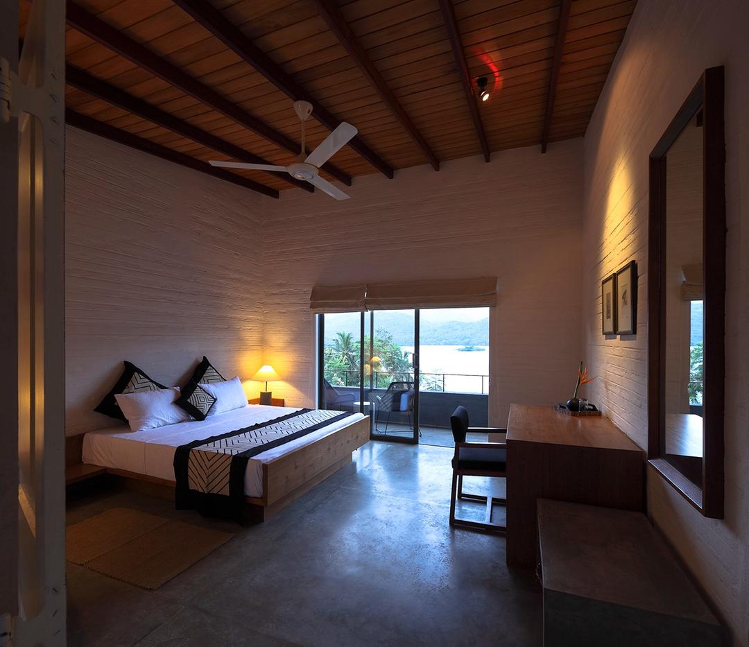 Digana bedroom with desk and lake view