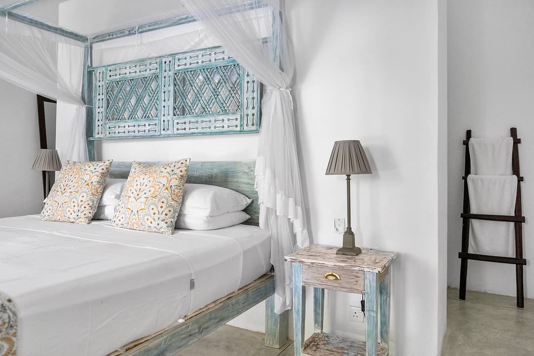 Ahangama bedroom with teal canopy bed