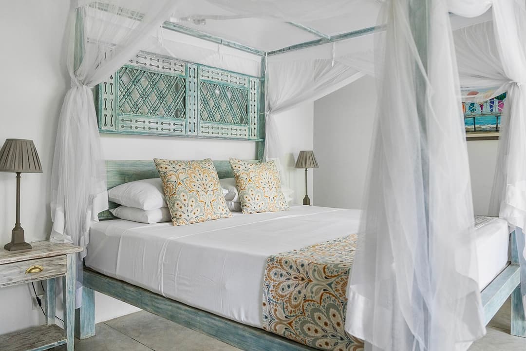 Ahangama bedroom teal canopy bed alternate view