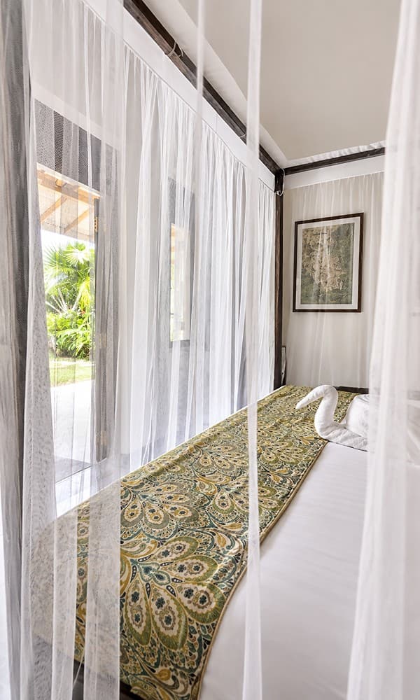 Ahangama bedroom with mosquito net and mirror