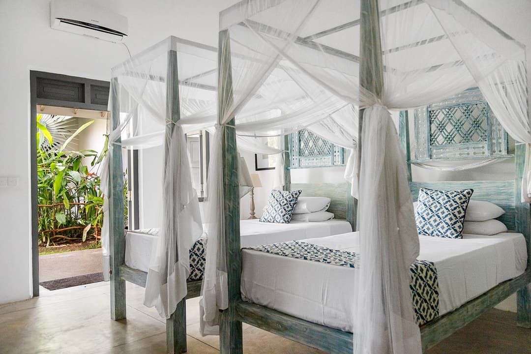Ahangama bedroom with four poster and doorway view