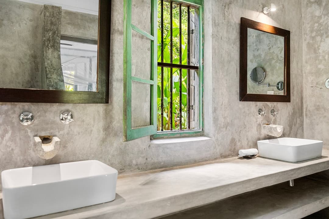 Ahangama bathroom with concrete walls and window
