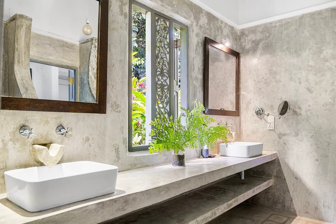Ahangama bathroom with concrete walls and sink