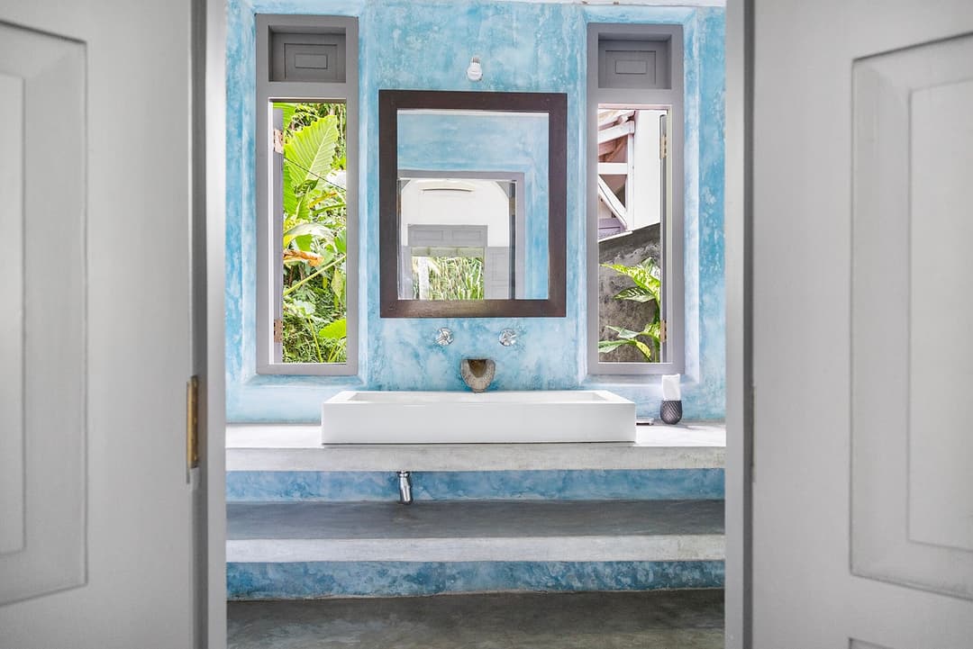 Ahangama bathroom with blue walls and double sink