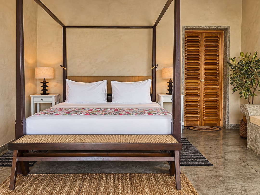 Villa Marisol bedroom four poster bed with wood floor
