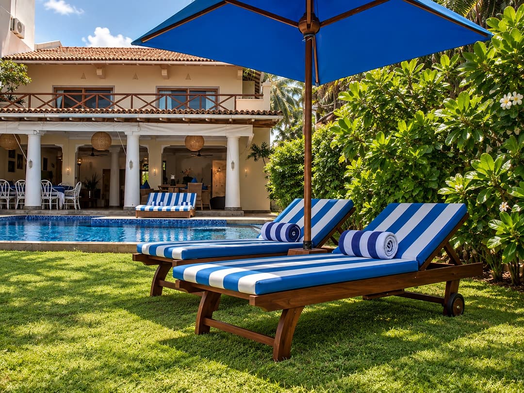 Villa Marisol pool with blue striped loungers