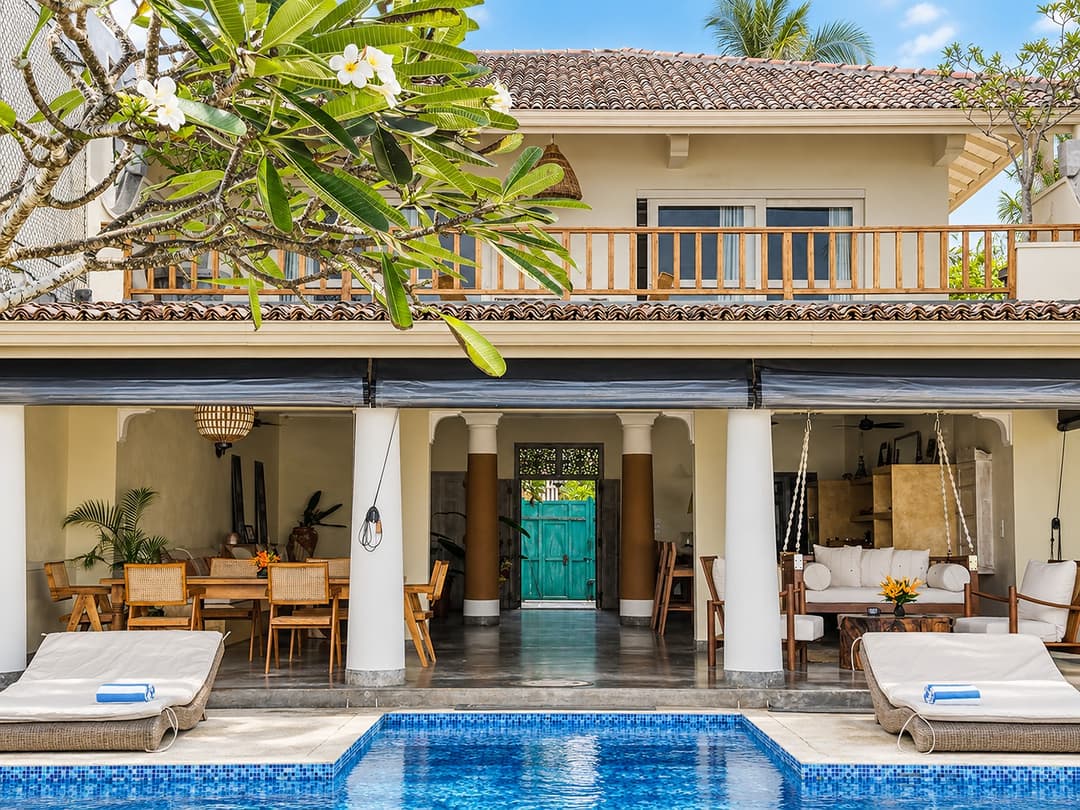 Villa Marisol poolside exterior with loungers
