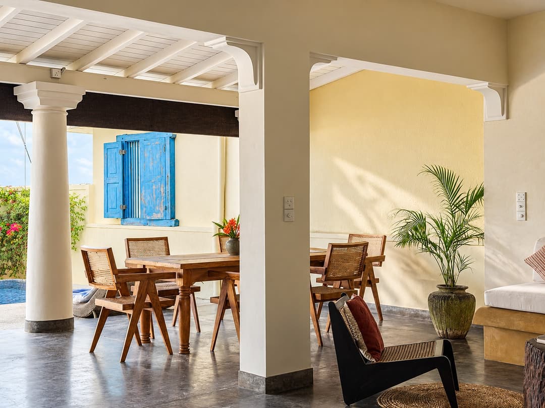 Villa Marisol veranda dining with blue shutters