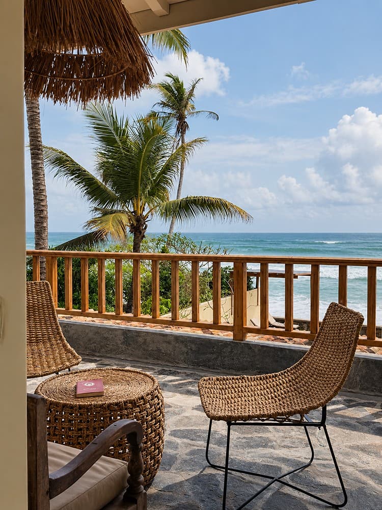 Villa Marisol veranda seating with palm view
