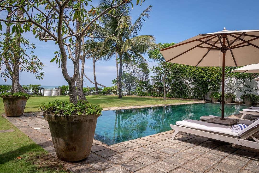 Tide House Habaraduwa pool with potted plant and umbrella
