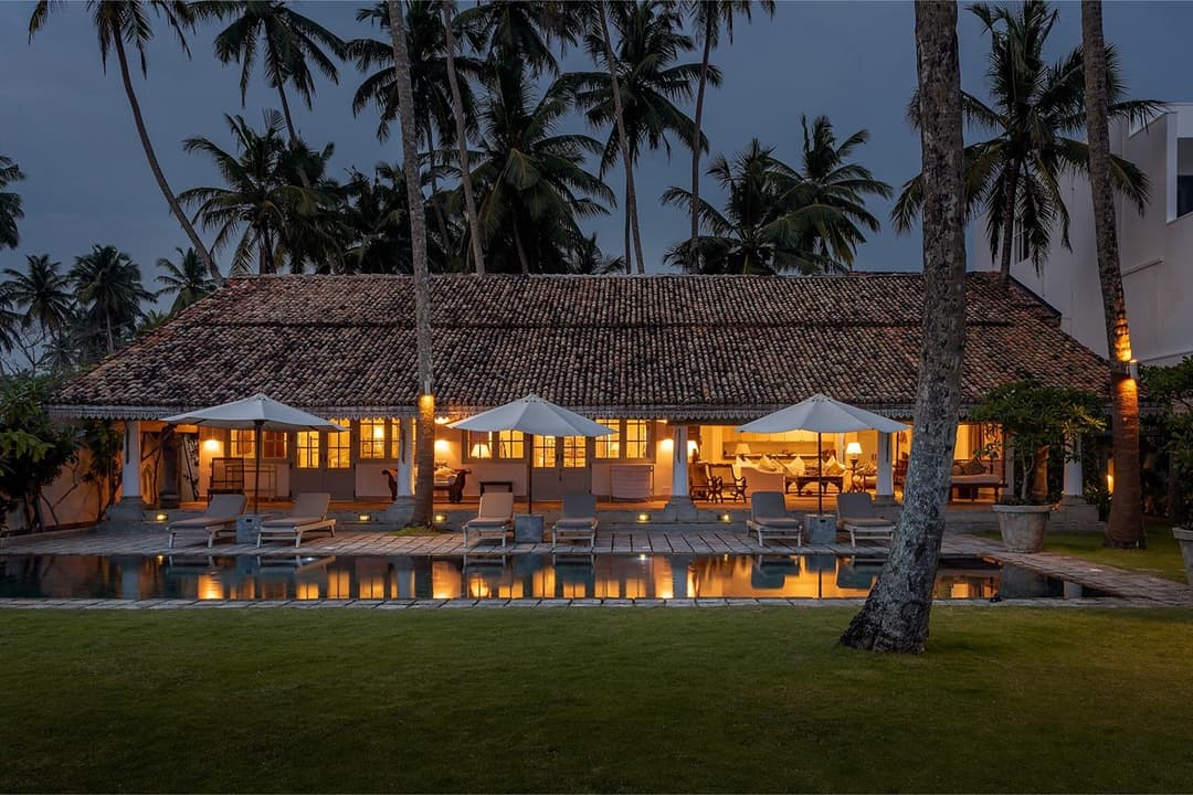 Tide House Habaraduwa pool at dusk with house lit