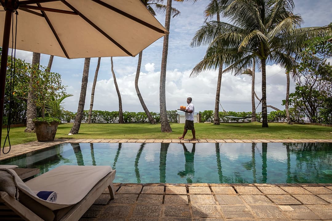 Tide House Habaraduwa pool by day with umbrella view