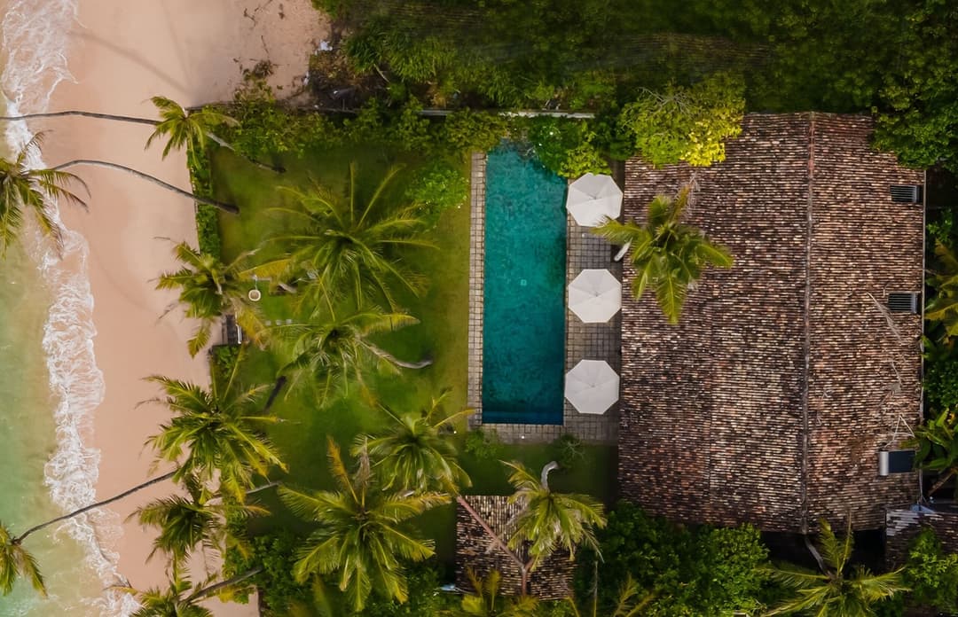 Tide House Habaraduwa aerial view of house and palms