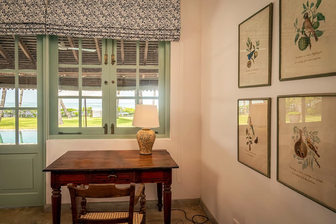 Habaraduwa bedroom with teal window and framed art