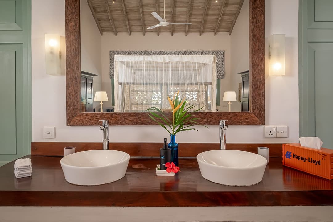 Habaraduwa bathroom with wood shelf and towel rack