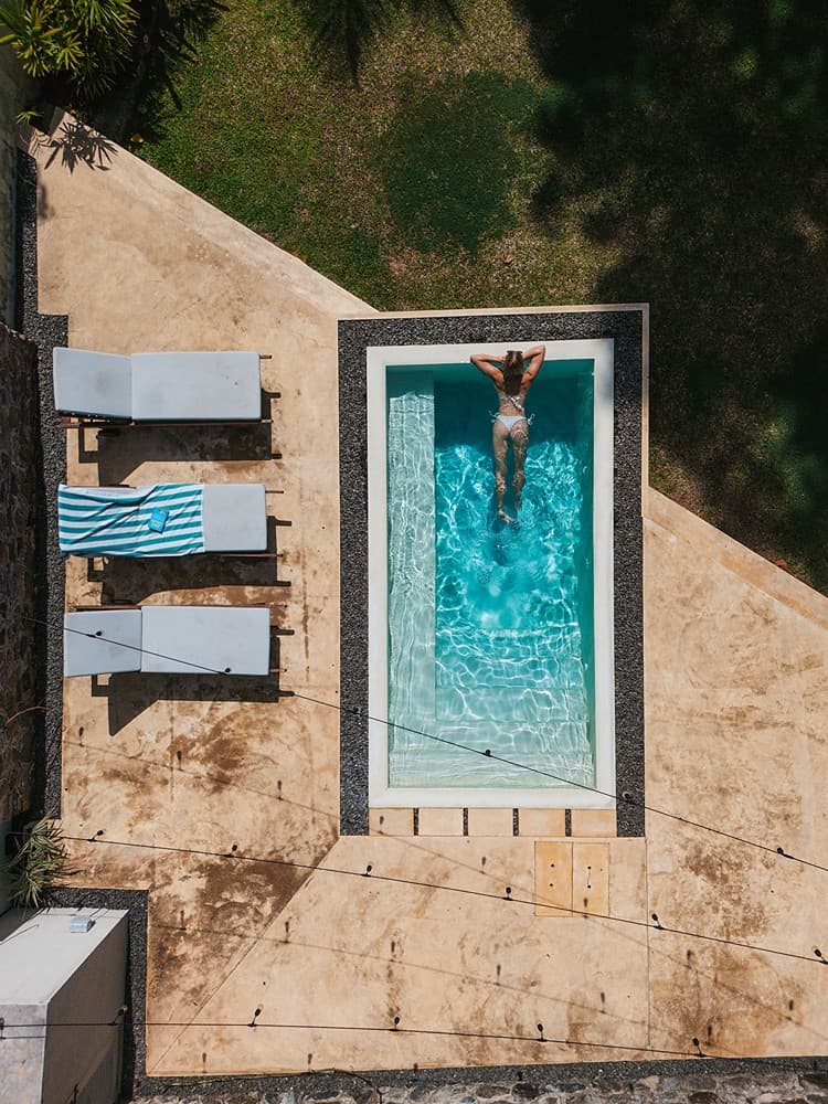 Kanda House Talpe aerial pool and lawn view