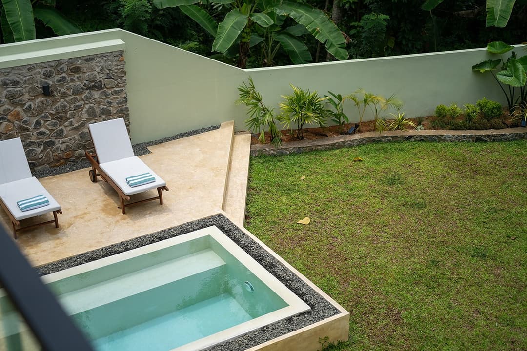 Kanda House Talpe aerial pool with lounger view
