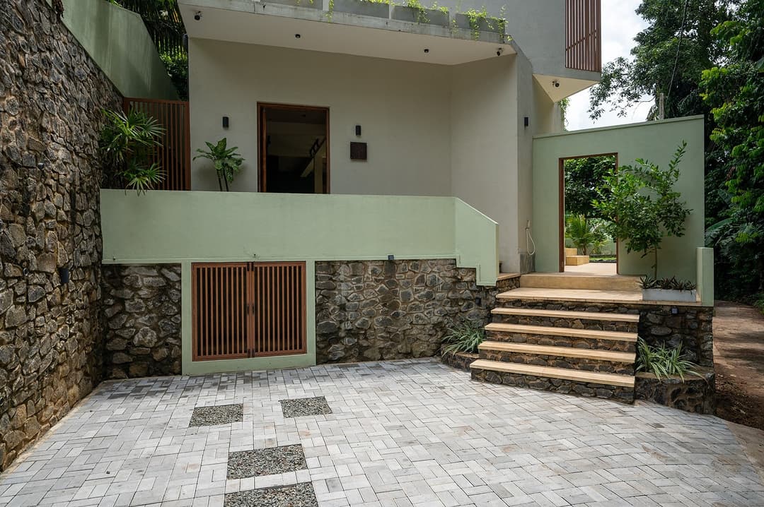 Kanda House Talpe entrance pathway with signage