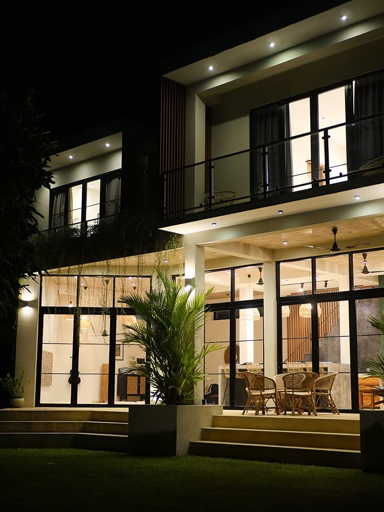 Kanda House Talpe exterior house lit at night