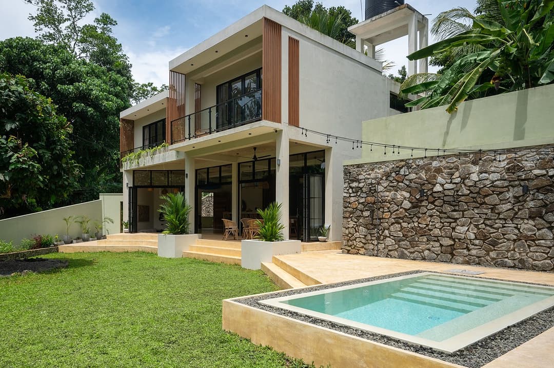 Kanda House Talpe exterior pool with garden view