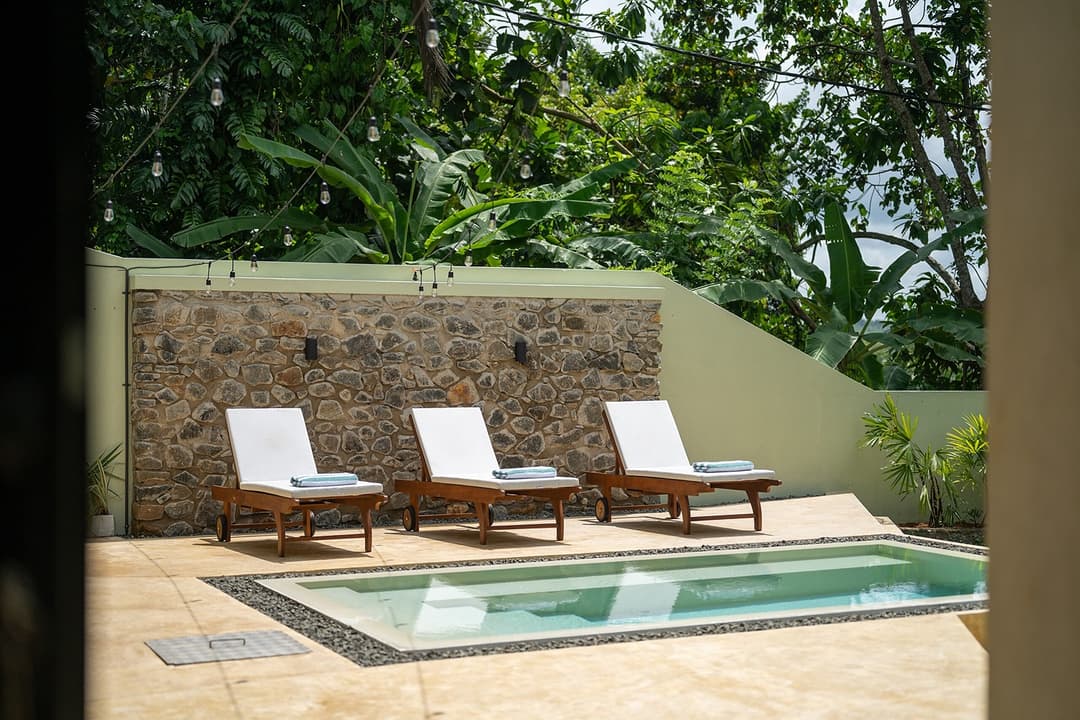 Kanda House Talpe exterior pool patio loungers