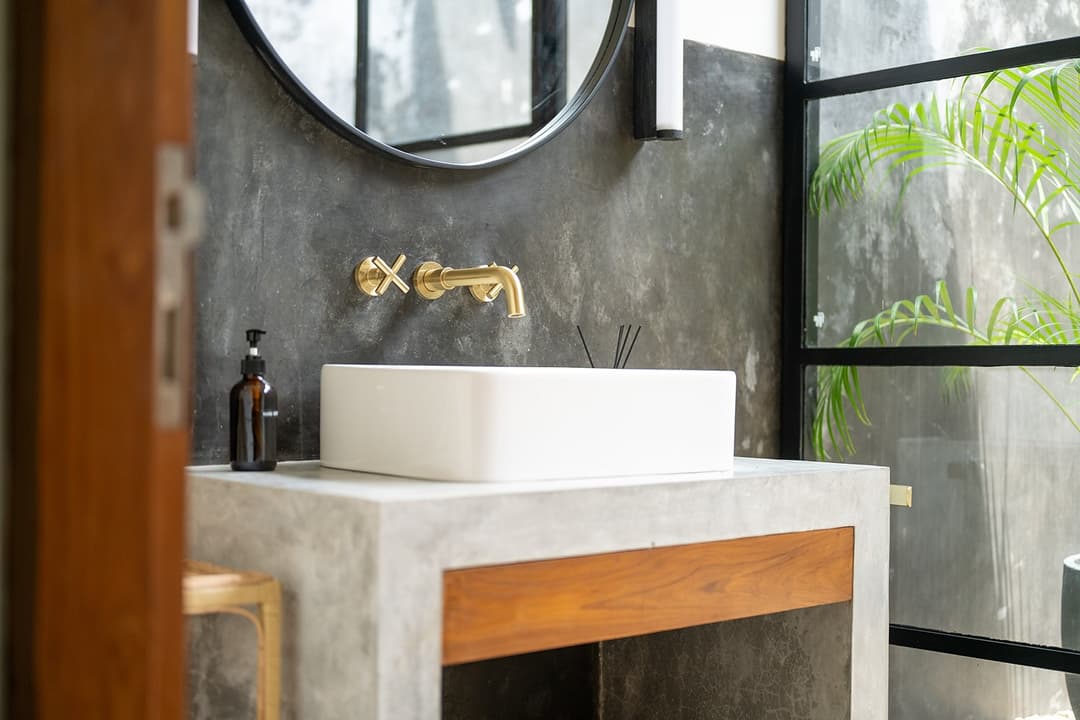 Talpe bathroom sink and mirror in stone