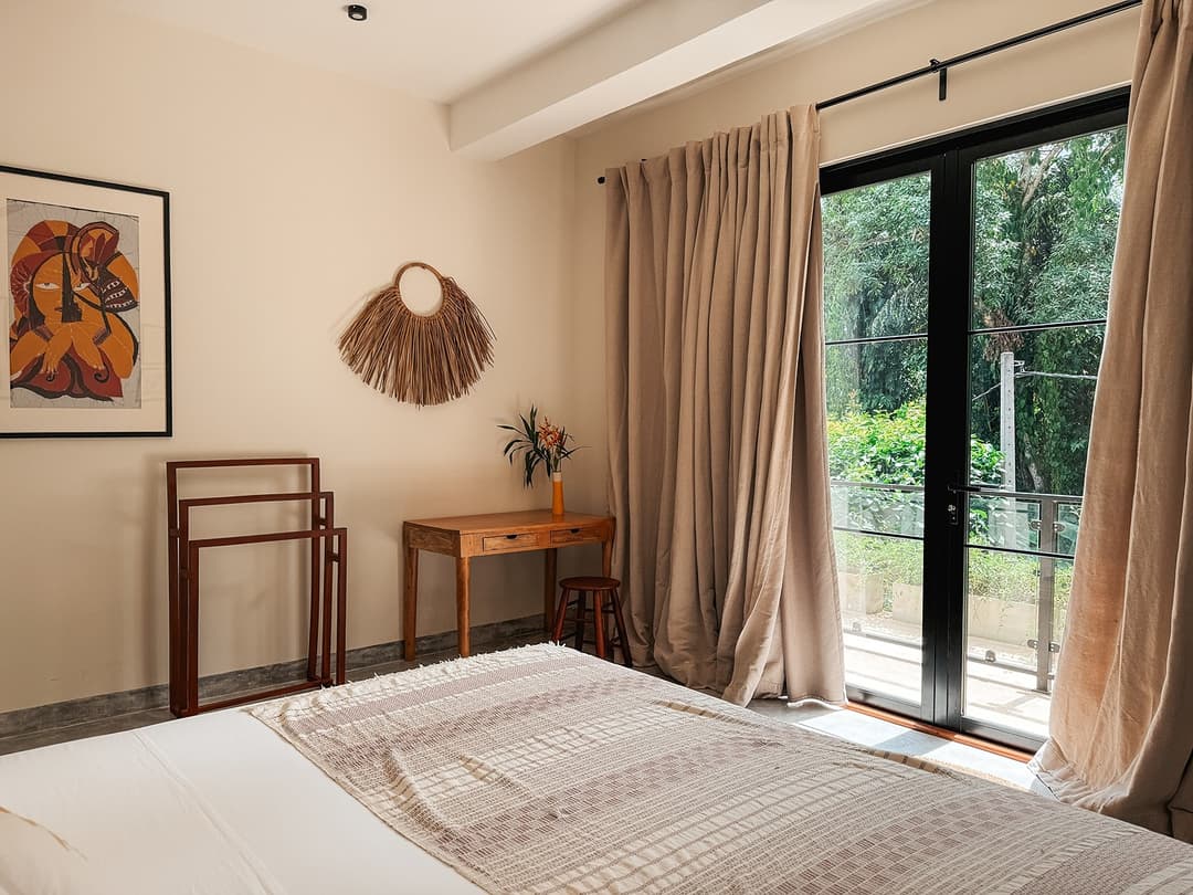 Talpe bedroom bed with glass doors view