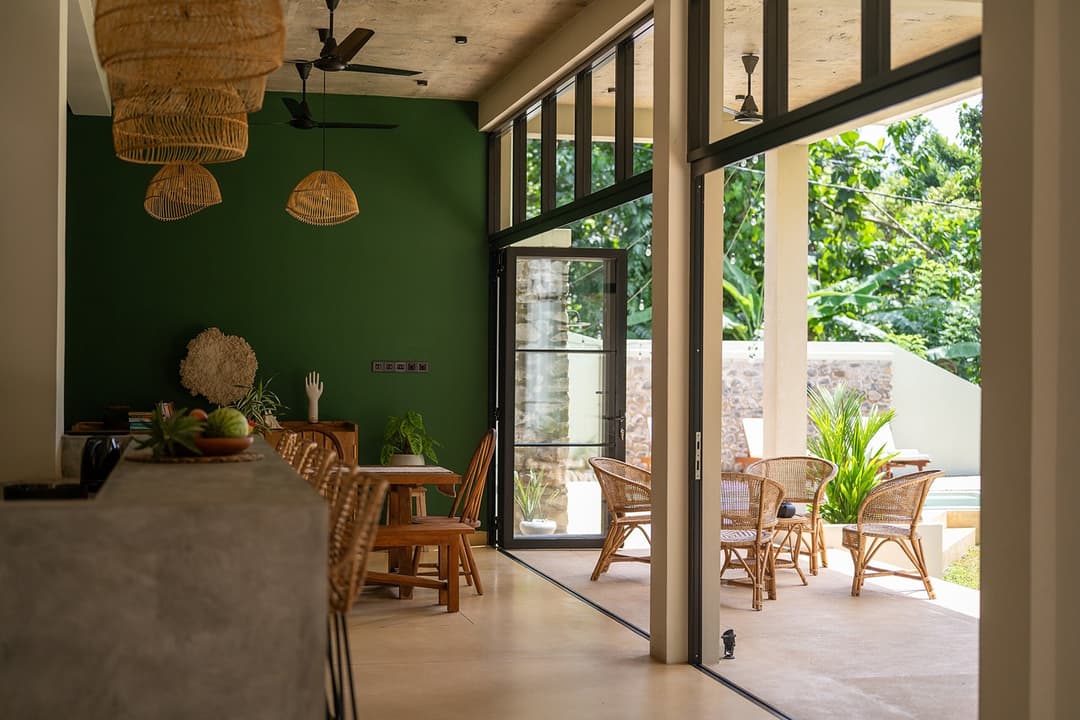 Talpe living and dining area with glass doors to garden
