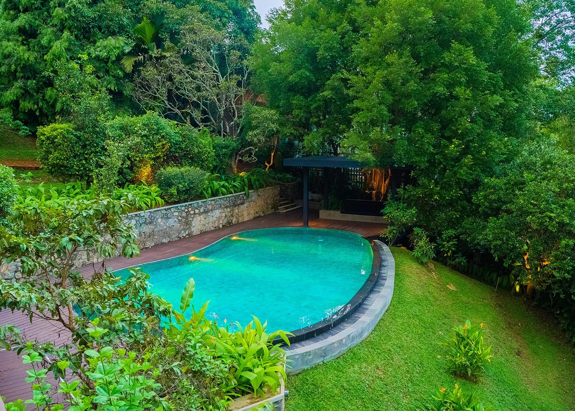 Aerial view of Celeste Bolgoda freeform pool surrounded by tropical garden