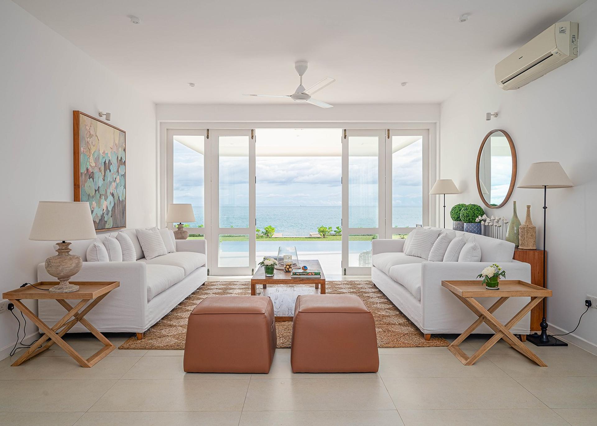 Mirissa luxury villa bedroom with king bed, ocean view and terracotta seat