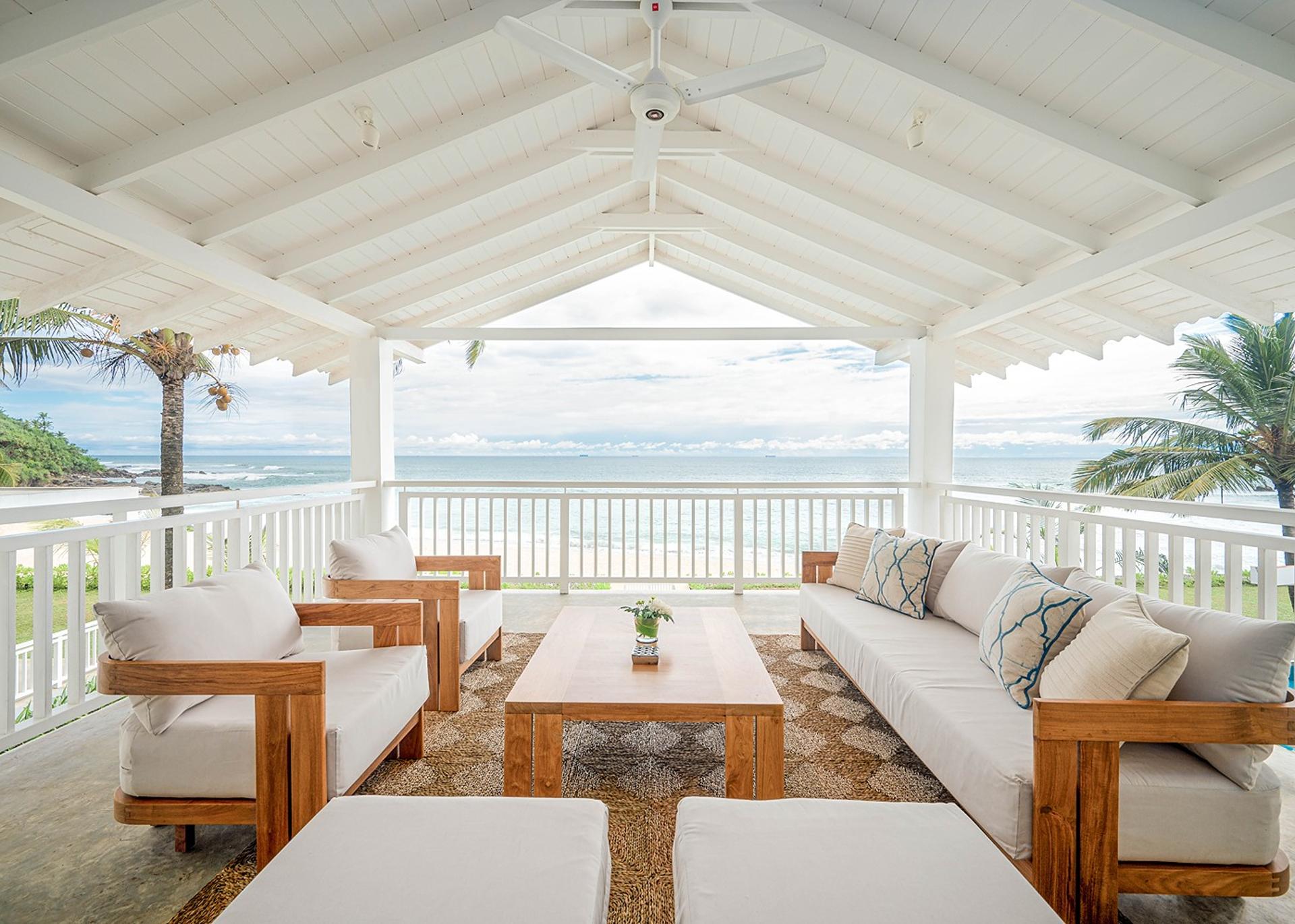 Mirissa luxury villa open pavilion with ocean view and white sofas