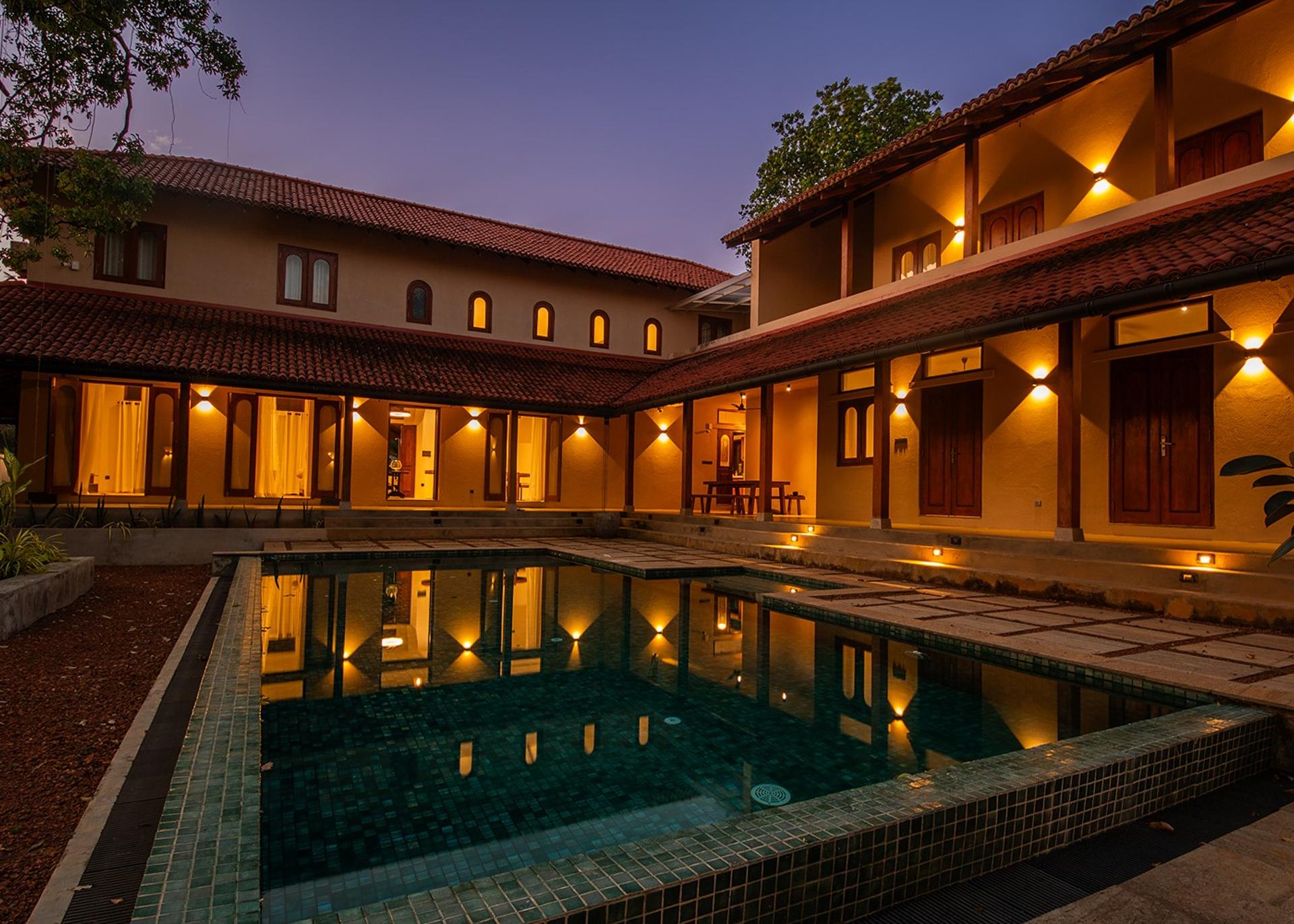 Origin Balapitiya villa and pool beautifully illuminated at evening