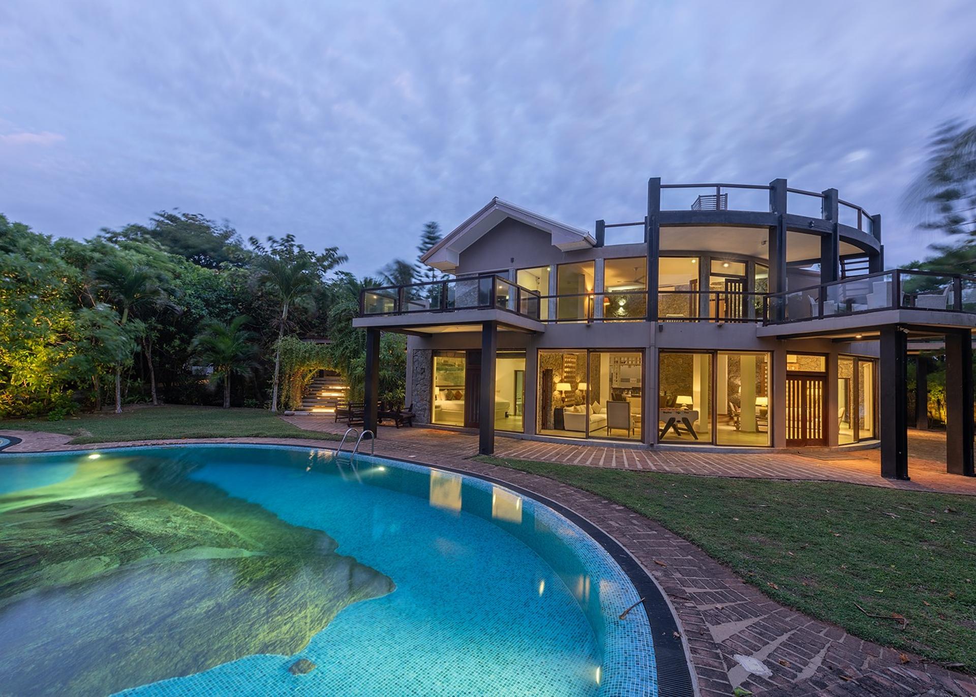 Casa Tua villa and pool illuminated at night