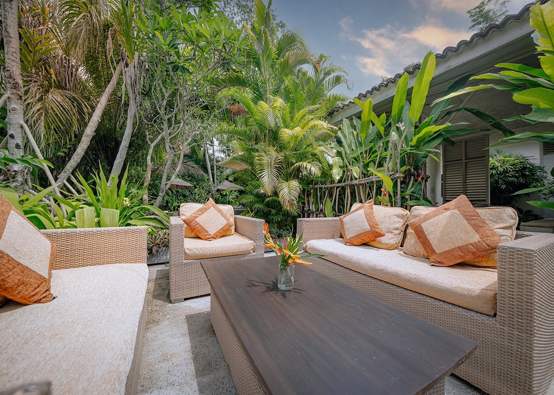 Rivers Edge outdoor lounge with cushions and garden view