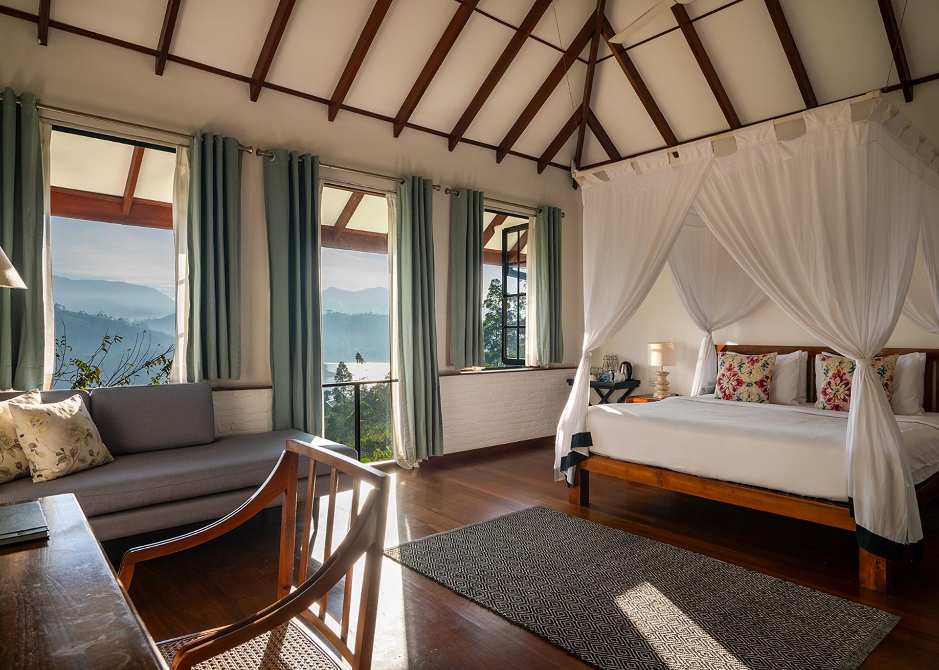 Norton lakeview bedroom with canopy bed and valley views at Camellia Hills, Dickoya