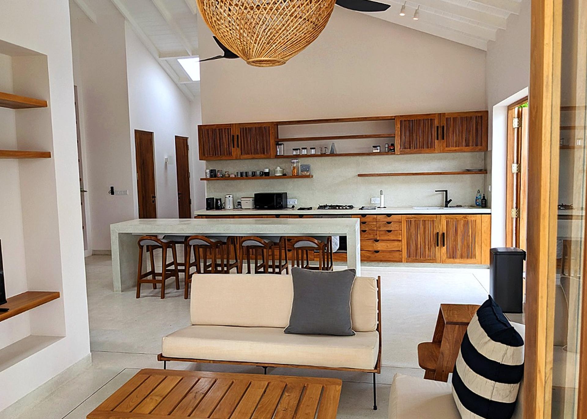 Open-plan kitchen and living area at Salt and Stone, Ahangama, Koggala, Sri Lanka