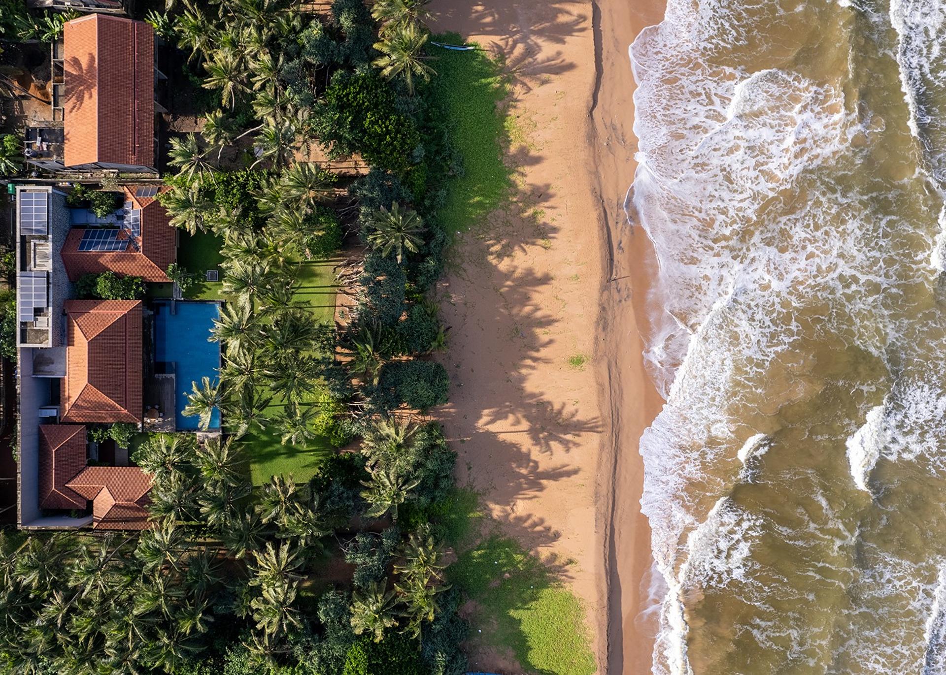 Kirana Villa Bentota aerial overhead view showing pool and Bentota beach, Sri Lanka
